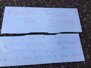 One of the broken signs had offensive language daubed on its back