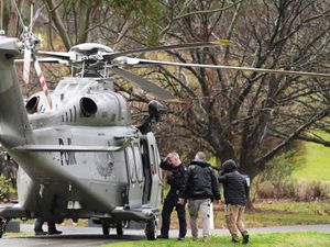 Supporting image for story: Suspect identified as Australia police shooting manhunt continues