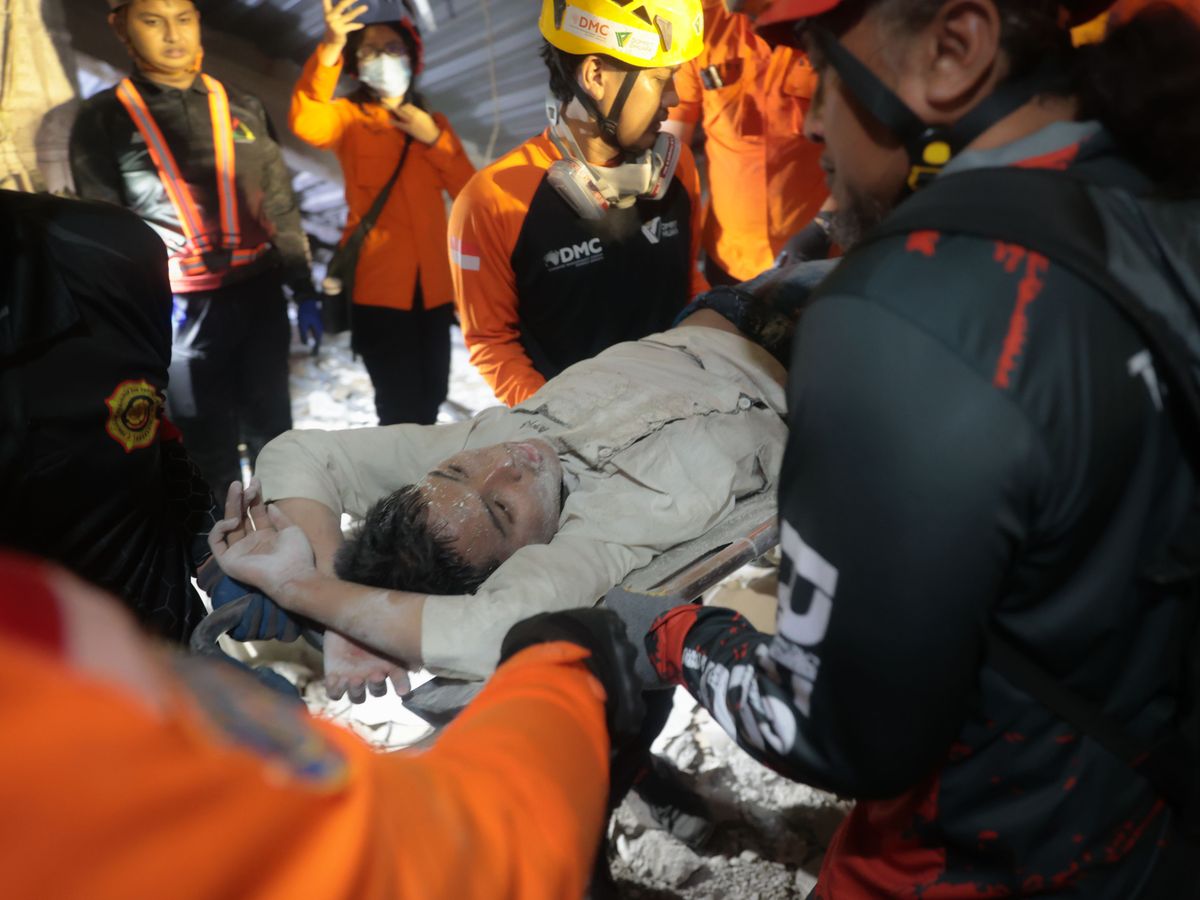 At least 65 students presumed buried under rubble of collapsed Indonesian school