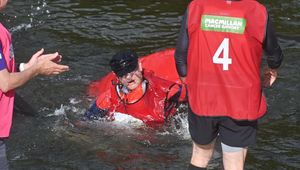 A drenched racer emerges from the River Severn