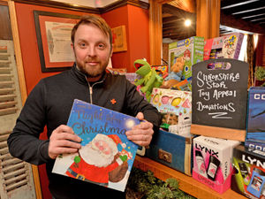 Supporting image for story: Pub regulars bring good cheer to our toy appeal
