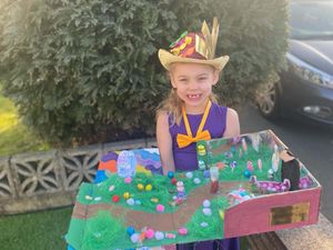 A little girl dressed up as Willy Wonka