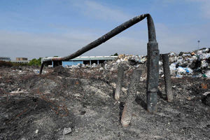 A lampost twisted by the heat of the fire