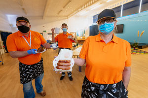 Adrian Pendleton, Russell Garner and Lorna Hicks at Wrekin View Primary School and Nursery in Wellington, where the hall has been turned into a community cafe for half term