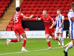 Danny Johnson celebrates his goal for the Saddlers