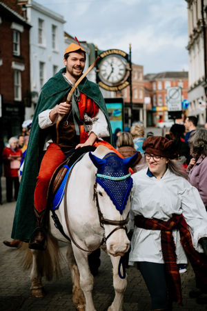 The King's herald arrives on horseback to deliver the charter