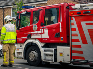 Supporting image for story: Firefighters rescue person trapped inside household room