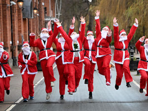 Supporting image for story: Shrewsbury's spectacular Santa squad spreads cheer in lunchtime charity fun run