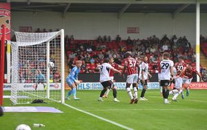 Burke's header nestled into the corner for Walsall.