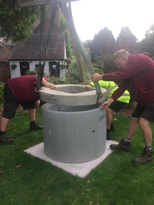 Workers from SAMCO help install the plinth in the grounds of Bridgnorth Castle