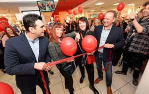 Shoppers Anna O'Mara and Margot McClane who were first in the queue cut the ribbon with store manager Rob Bannister and area manager Andy Boom