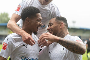 Ricardo Dinanga and Montel Gibson celebrate (Kieran Griffin)