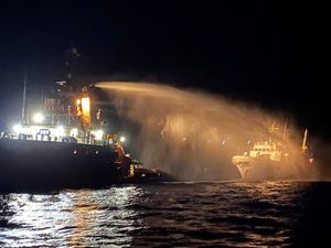 A fire is doused aboard a ship at sea