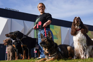 Paralympian Ellie Simmonds, newly announced in the presenting line-up for the Crufts TV show, poses alongside a group of dogs during the official launch of Crufts Dog Show 2025 at the NEC Birmingham. PA Photo. Photo: Jacob King/PA Wire