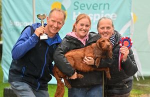 Kerry Blunt with the best in show winner Bobby (centre), Richard Morris from Copthorne Vets and Philomena Nash from Severn Hospice