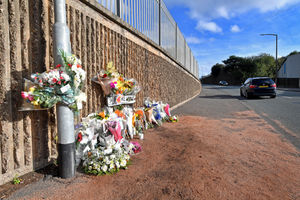 Floral tributes at the scene of the fatal crash on Powke Lane.