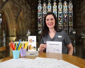 Cathedral Hearing's Principal Audiologist Laura Evans at The Hub at St Mary's with some of the fun activities for adults and children on their 'Hear to Help' special education day