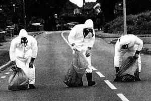 Council workers cleaning up the asbestos ash in 1983 in the Donnington area