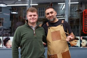 Owen Norgrove with Barber Firat Davutoglu atTurkish Barber in Ludlow, Shropshire. Barber Firat saved customer's Owen's life after finding lump on his neck that turned out to be Hodgkin Lymphoma cancer. Owen is in remission now