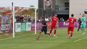 Charlie Wragg, on loan from Walsall, celebrates scoring the opener for Halesowen.