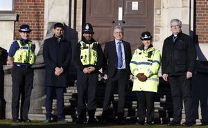 Simon Foster (Centre) with Kim Madill (to his right) and West Midlands Police officers outside the base