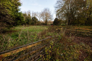 The land behind the pub where the houses are planned to be built