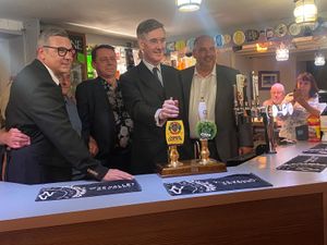 Jacob Rees Mogg behind the bar at Sedgley Conservative Club with (L-R) Sedgley councillor Ian Sandall, Mark Littlewood and Bill Etheridge