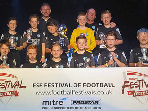 Supporting image for story: Winners Shifnal Harriers presented trophies by England legend Bryan Robson