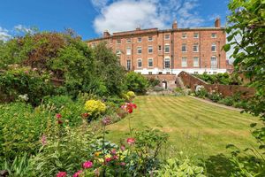 The terraced house has sprawling lawns