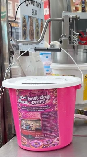 Pink donation bucket at Old Tom's Donuts