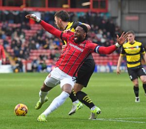 Jamille Matt and Niall Canavan during Walsall's clash with Barrow