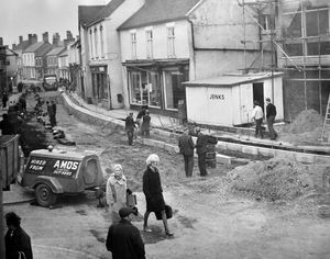 Road works in High Street, Dawley, on April 26, 1967. The work was to resurface the road and the closure of the road caused a storm of protest from Dawley Urban District Council's highways and public works committee. Councillor W. Wilkes said: 'Four weeks is far too long for a main shopping street and main road to be closed. The job ought to be done in a shorter time.'