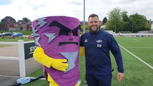 Gus T Hurricane poses alongside player Sam Bowring