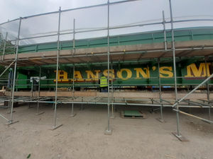  A signwriter is currently putting the finishing touches to the new structure’s iconic paintjob