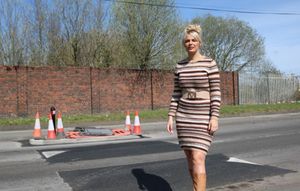 Councillor Beverley Momenabadi next to the speed bumps she spent three years campaigning for in Dixon Street