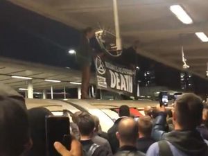 Supporting image for story: Commuters fight back after Extinction Rebellion protesters climb on top of Tube