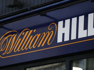 A sign outside a branch of William Hill, Ludgate Hill, in central London