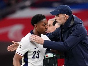 Thomas Tuchel hugs Myles Lewis-Skelly as he is substituted on England debut