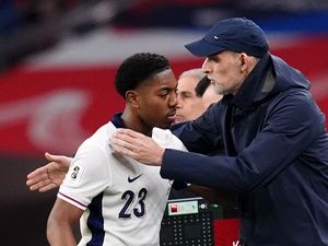 Thomas Tuchel hugs Myles Lewis-Skelly as he is substituted on England debut