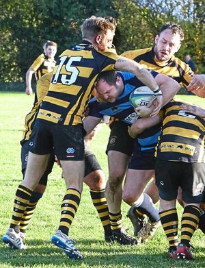 Marcus Pugh is halted by four Stafford players.
