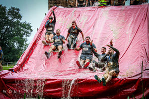 The Legionella and Fire Safe Services team take on the giant water slide at the Autumn Wolf Run, completing the muddy 10k challenge to raise funds for The Safety Net Foundation.