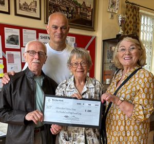 Roger Cox presenting the cheque to the Shifnal Local History Group