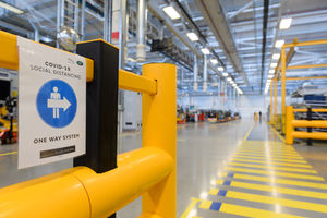 New signs point out the one-way route inside the factory