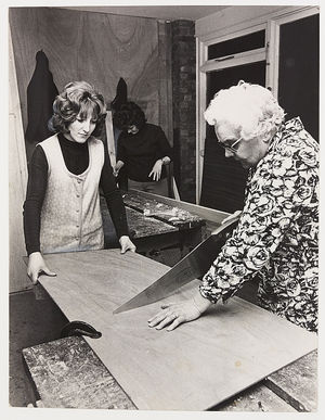 Ladies' Woodwork Classes in Cannock. Cissie Watkins concentrating on a sawing operation, helped by Gillian Loftus, at the town's community centre. January 13, 1973