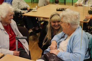 One of the Agape staff members with clients