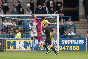 Russ Griffiths punching away Hereford cross.