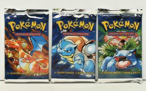 Lot 462A is this Pokémon Base Set booster pack art set, with three sealed packs featuring the Charizard, Blastoise and Venusaur designs.