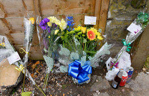 Floral tributes left by loved ones near to the scene of the fatal shooting