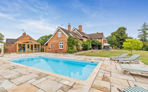 The property features an outdoor swimming pool. Picture: Savills/Rightmove