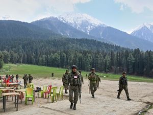 Indian security officers inspect the site of the attack